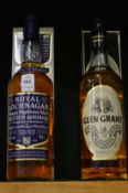 Royal Lochnagar malt whisky, one bottle boxed together with a boxed bottle of Glen Grant whisky.