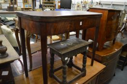 A 19th century mahogany D shaped fold-over tea table.
