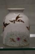 A Chinese porcelain water pot painted with birds and fish.