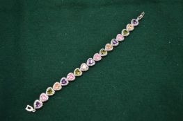 Silver plated bracelet set with heart shaped semi-precious coloured gem stones.