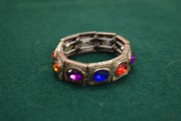 An Eastern silver and hard stone set bracelet of small size.