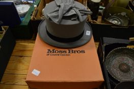 A Moss Bros grey top hat size 7 3/8 together with a pair of gloves and original box.