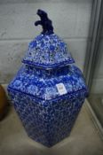 A large blue and white hexagonal shaped jar with pierced cover and internal lid.