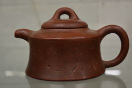 A Chinese Yixing teapot.