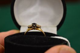 A 9ct gold, sapphire and diamond ring, size N.
