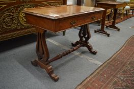 A 19th century mahogany single drawer side table with lyre end supports.