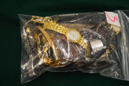 Quantity of assorted wristwatches.