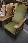 A 1940's oak framed reclining armchair.