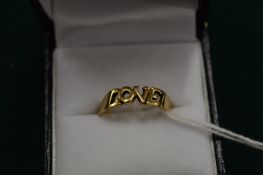 A 9ct gold ring pierced with the word 'Love', size O.