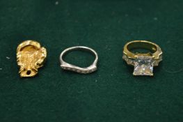 A 14ct gold ring, small white gold and diamond ring and a boxing glove charm.