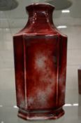 A large Chinese red glazed flambe style porcelain octagonal shaped vase.