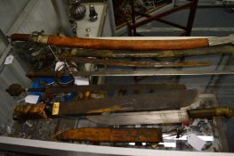 A collection of six various swords and knives.