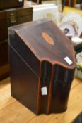 A Georgian mahogany serpentine fronted cutlery box with contents.