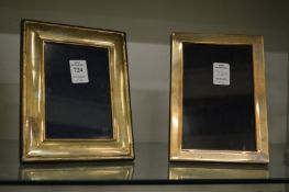 Two silver photograph frames.