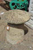 A small reconstituted stone saddle stone.