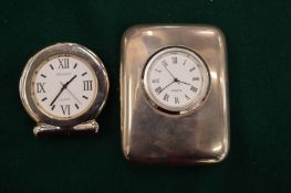 Two quartz desk clocks.