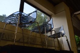 A set of three chrome and perspex chairs made by Calligaris, Italy.