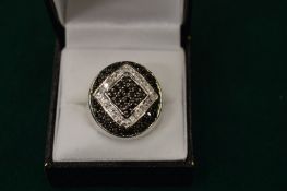 A silver diamante and blue stone ring, boxed.