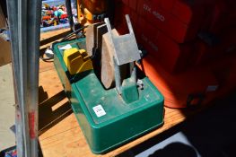 A Record electric wet stone and a De Walt site radio.