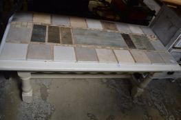 A tile top coffee table.