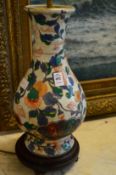 A Chinese or Japanese Imari decorated baluster shaped vase lamp.