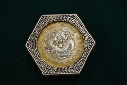 A Chinese octagonal shaped coin box and cover.