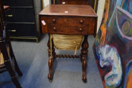 A Victorian walnut drop-flap combination writing and work table.
