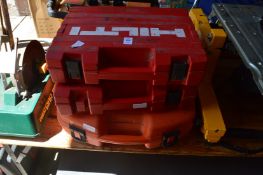 Two Hilti nail guns together with a Paslode nail gun.