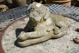 A reconstituted stone model of a dog.