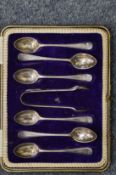 A set of six silver coffee spoons and sugar tongs, cased.