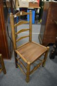 Six 19th century ash ladder back dining chairs.