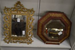 Two decorative mirrors.