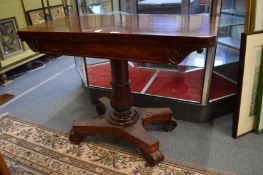 A 19th century mahogany D shaped fold-over tea table on carved and turned column support with