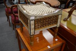 A Middle Eastern Thebes style abalone inlaid and mashrabiya work stool with woven seat.