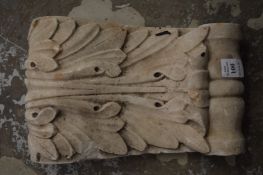 A reconstituted stone corbel.