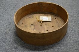 A bent wood cheese mould.