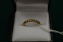 A gold and diamond ring, size O.