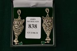 A pair of ruby, emerald and marcasite panther drop earrings.