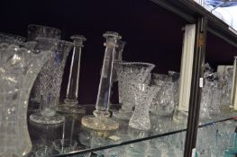 A large quantity of cut glass vases, decanters etc.