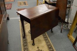 A George III mahogany single drop-leaf dining table.