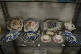 Two Meissen cups and saucers decorated in puce depicting young lovers together with other decorative
