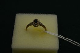 A 9ct gold, sapphire and diamond ring, size O.
