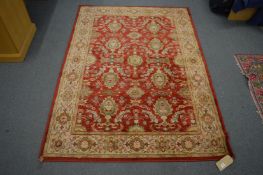 A machine made Persian style rug 187cm x 132cm.