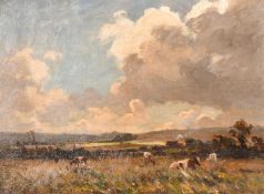 Wycliffe Egginton (1875-1951), cattle feeding in a landscape under changing skies, oil on canvas,