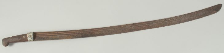 AN EARLY ISLAMIC SWORD with wooden handle, 82cm long
