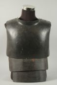 A WWI GERMAN TRENCHWARE METAL BODY ARMOUR.