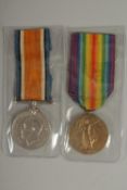 ALEXANDER PERRIE. HIGHLAND LIGHT INFANTRY. PTE 23628. DUO with ribbons.