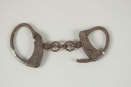 A PAIR OF IRISH REBUPLICAN IRON HAND CUFFS.