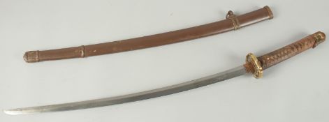A JAPANESE SWORD with early blade and metal sheath. 1m 12cm long