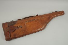 A LEATHER 'LEG O' MUTTON' SHOTGUN CASE.